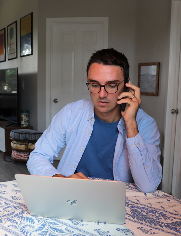 Man on phone and laptop